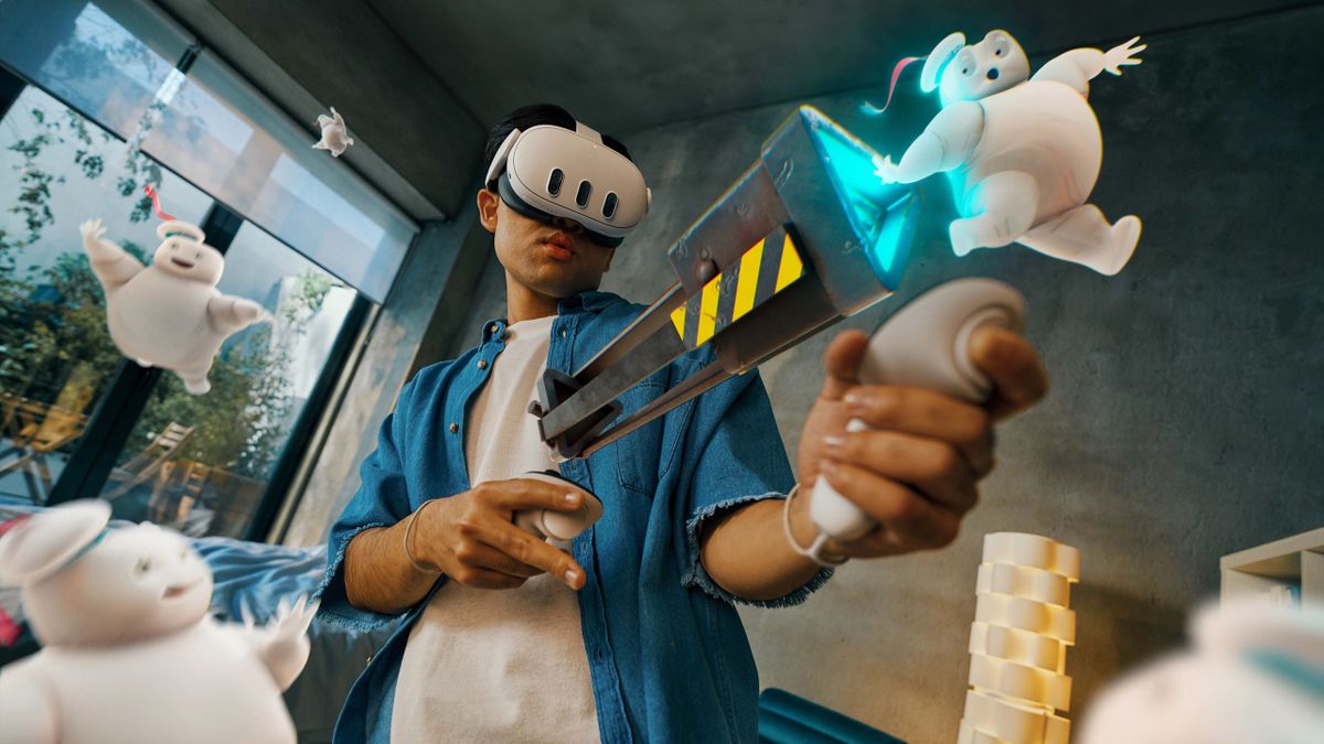 A Meta Quest 3 player sucking up Stay Puft Marshmallow Men from Ghostbusters in mixed reality using virtual tech extending from their controllers